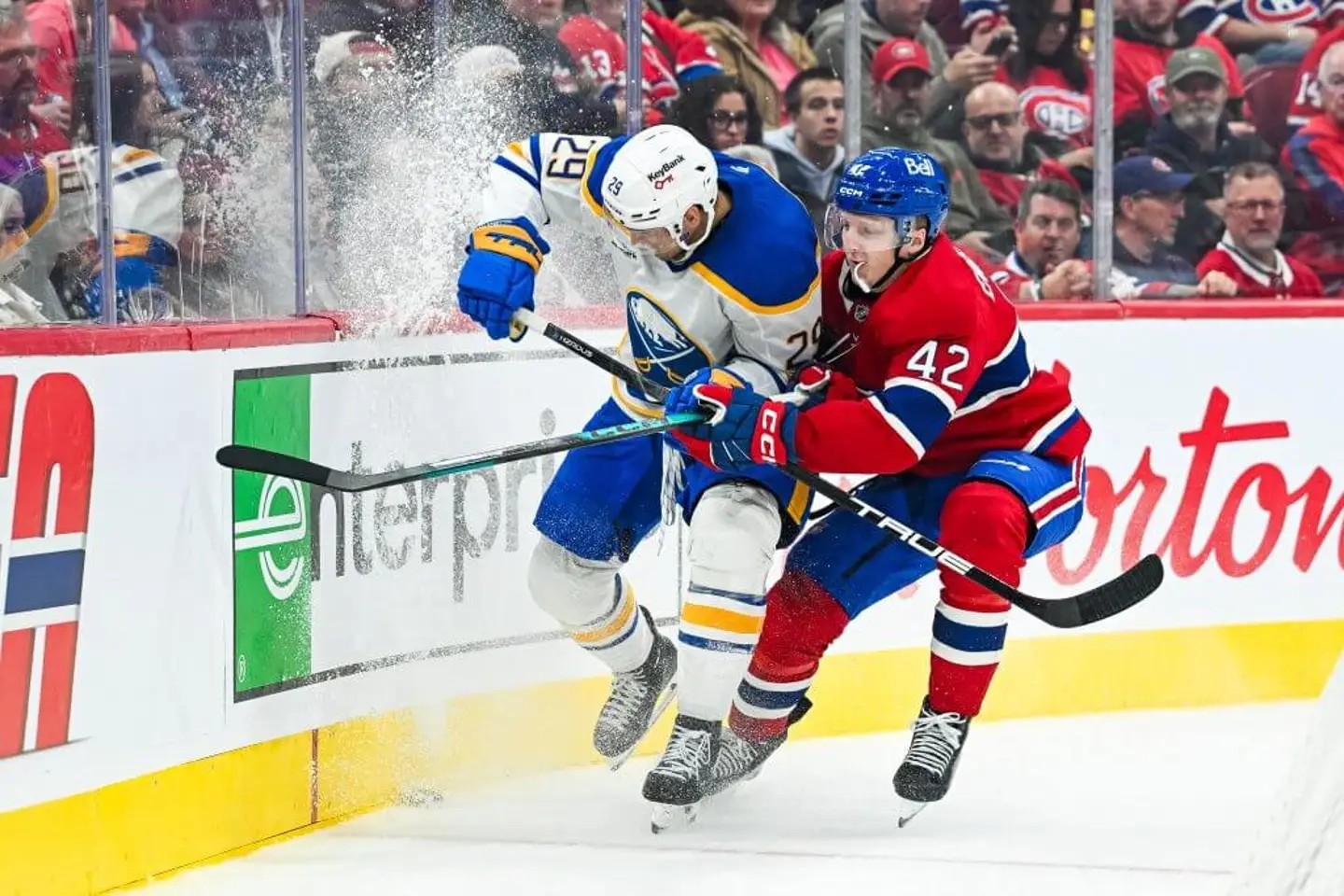 Adam Engström battles Buffalo Sabres forward Beck Malenstyn along the boards at the Bell Centre